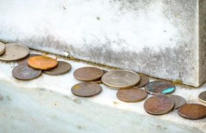 Meaning Behind the Tradition of Coins on Gravestones